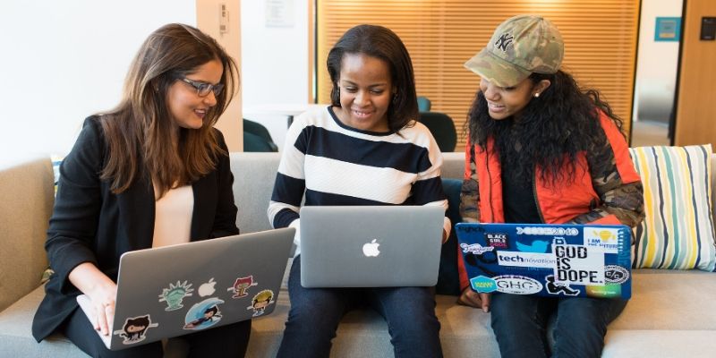3 girls have their laptops open and are building courses on teachable