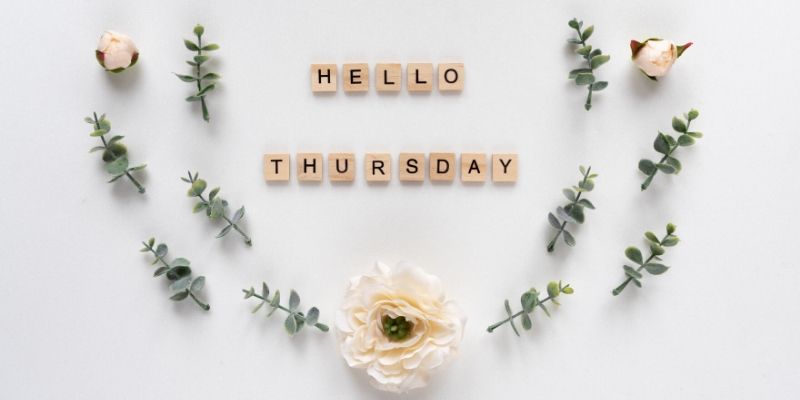 The words Hello and Thursday are spelled out with scrabble tiles