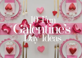 A festive table setup with white plates, pink hearts, and red accents sets the mood for Galentines Day. Pink and red decorations adorn the table alongside flowers. Text overlay reads, 10 Fabulous Galentines Day Ideas.