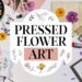 Flat lay of pressed flower art materials, perfect for creating stunning home decor. The scene features colorful flowers, paper, scissors, glue stick, and a frame. A round label in the center reads Pressed Flower Art adorned with floral decorations.