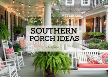 A charming porch with white rocking chairs, floral cushions, a swing, and lush hanging ferns. String lights hang above, and a sign reads Southern Porch Ideas. This Southern decor showcases classic wooden details and an inviting garden backdrop that truly steals the show.