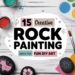 A colorful assortment of painted rocks with various designs, surrounded by art supplies like paints, brushes, and markers. The text reads 15 Creative Rock Painting Ideas for Fun DIY Art.