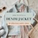 Flat lay of a denim jacket, floral dress, straw tote bag, white sneakers, and sunglasses on a beige surface. Title reads How to Style a Denim Jacket: 10 effortless outfit ideas with clothing illustrations.