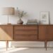 Transform thrifted finds into profit by styling a mid-century modern sideboard with vintage decor—think lamps, books, greenery, and art—for an eye-catching look that can earn you $100 or more.