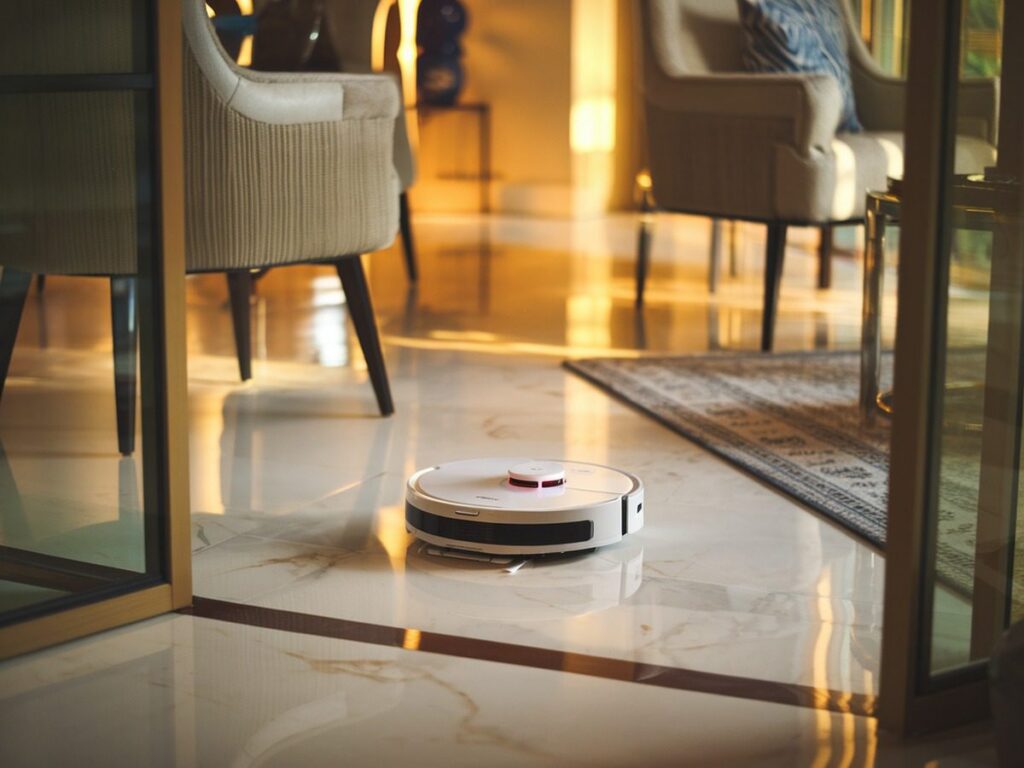 The rv-premium sweeps gleaming marble floors in a bright, upscale living area, reflecting its top-rated robotic vacuum status.